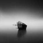 grayscale photo of house on water