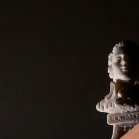 Wolfgang Amadeusz Mozart - a close up of a statue of a person