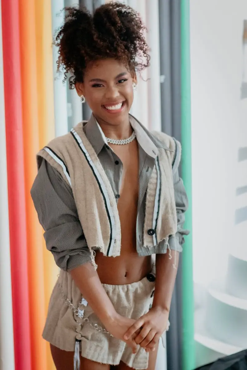 Stylish portrait of a smiling woman in a modern outfit with vibrant colors in São Paulo, Brazil.