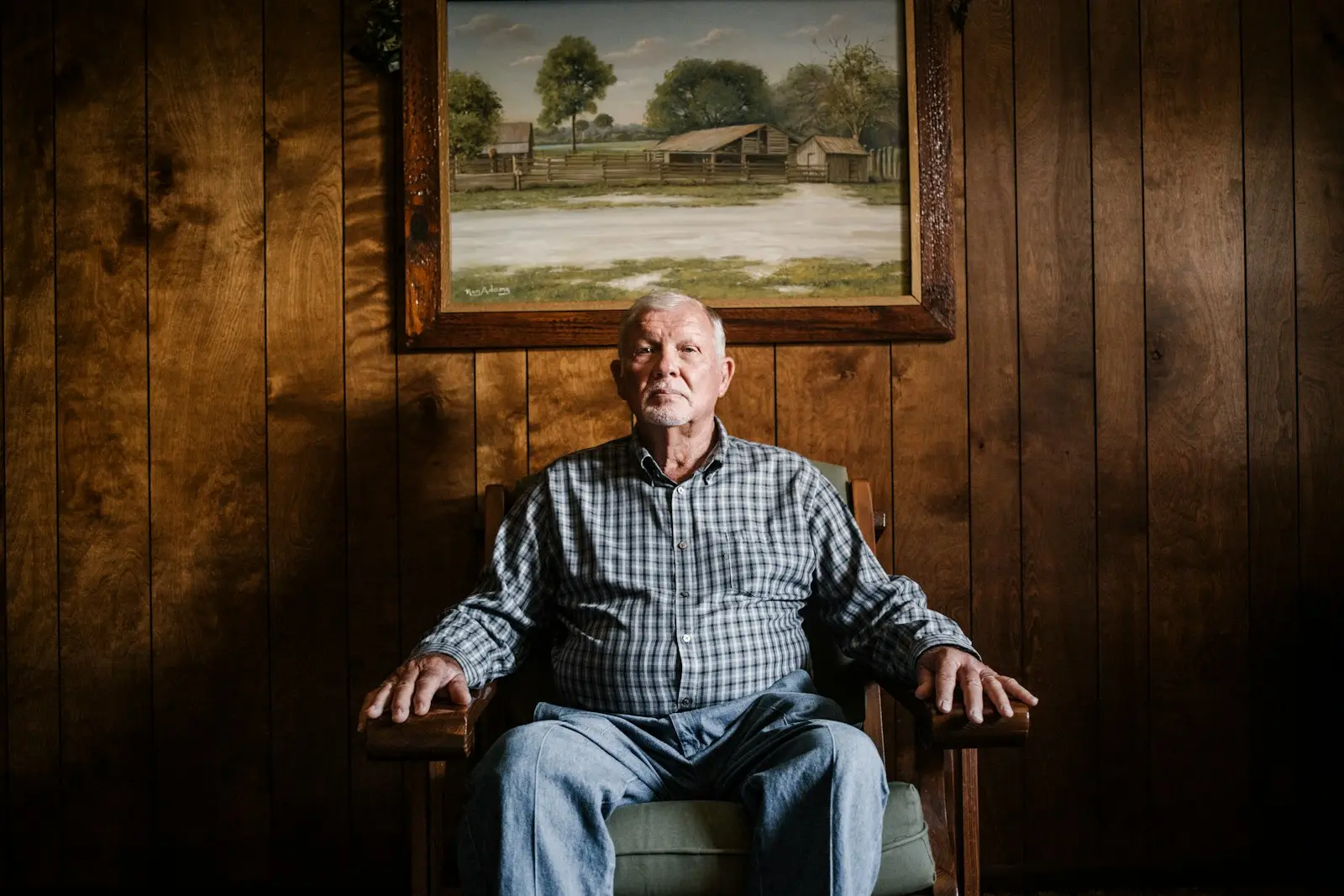 Mieszko man sitting on armchair beside photo frame